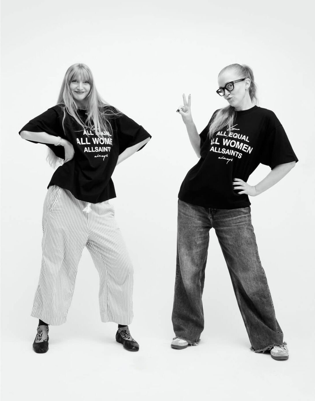 Photograph showing two women standing next to each other wearing print AllSaints t-shirts.