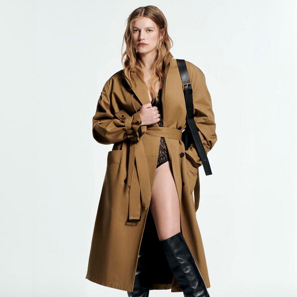 Image of a woman in the brown belted coat